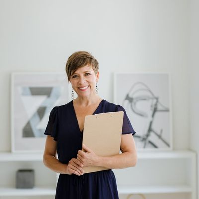 A professional and friendly portrait of a female yoga instructor, Olha Zarichna.